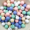 Runde silikonperler i ulike farger. Her vises de i størrelse på 15mm.